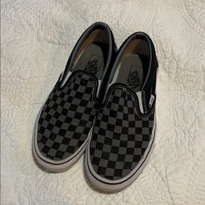 Black and gray checkered slip-on Vans